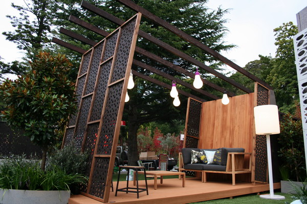 Patio garden with decorative wooden protective grilles