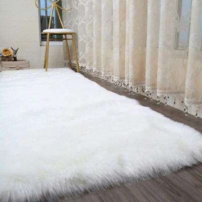 1699734679_white-faux-sheepskin-rug.jpg