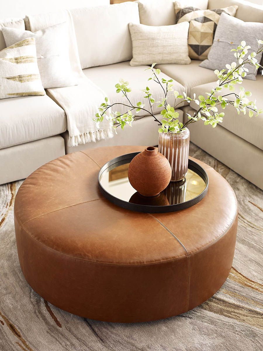 Round storage ottoman for room coziness