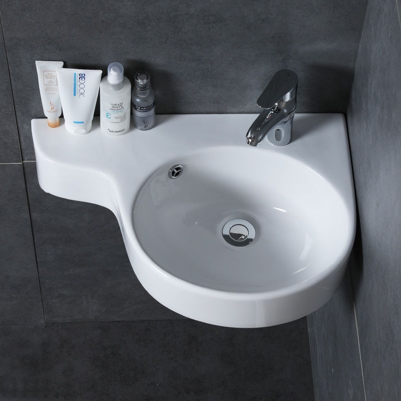 Space saving corner bathroom sink