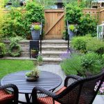 a small patio garden filled with plants SOSJGXT