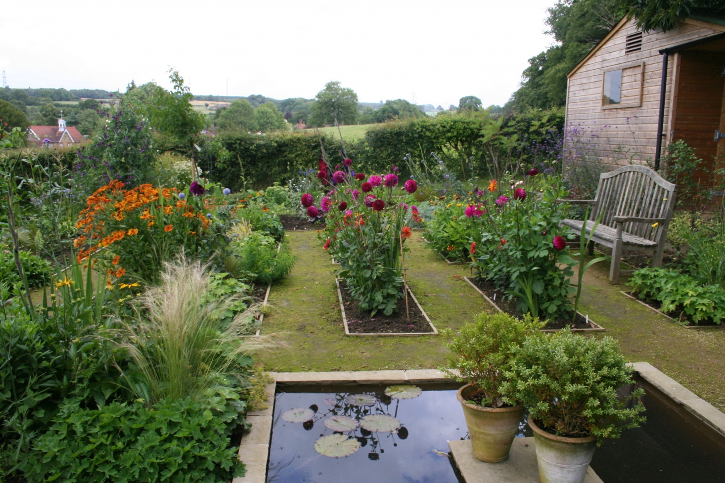 annie guilfoyleu0027s kitchen garden includes beds of colorful dahlias. MTJEXDV