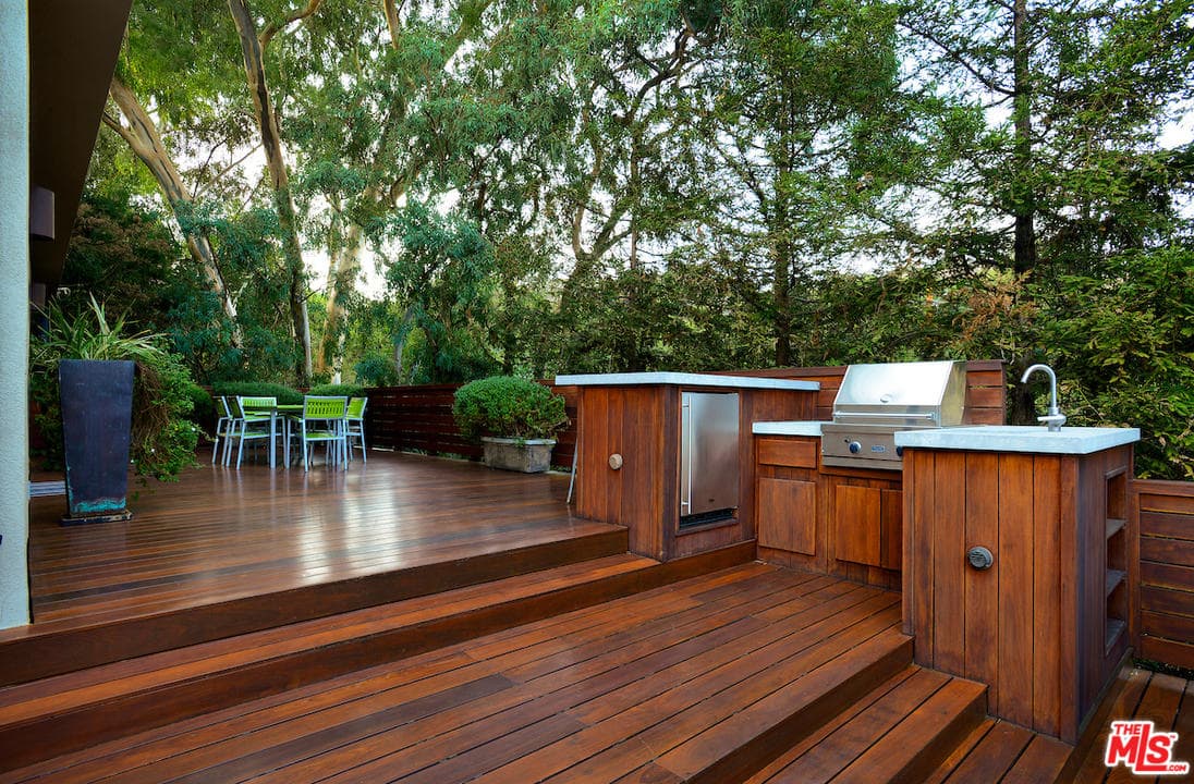 backyard decks a spacious deck features a barbecue area and a patio perfect for JSTLXGJ