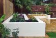 contemporary gardens contemporary deck garden with built-in seating and tropical planting ILAHDOV