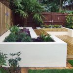 contemporary gardens contemporary deck garden with built-in seating and tropical planting ILAHDOV