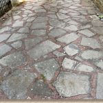 crazy paving poorly laid concrete flagstones. wide joints reveal too much mortar PKDRPOQ