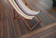 dark stained bamboo decking whith a deckchair YOKVZQP