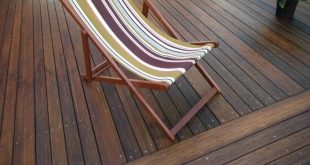 dark stained bamboo decking whith a deckchair YOKVZQP