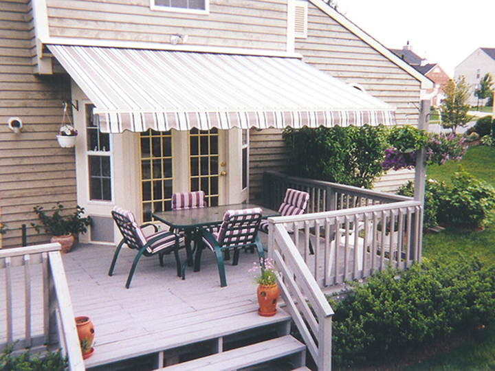 deck awnings striped awning over double doors with outdoor chairs and table on a GLIEFYJ