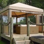 garden decking ideas a decking seating area under a gazebo CMXACXW