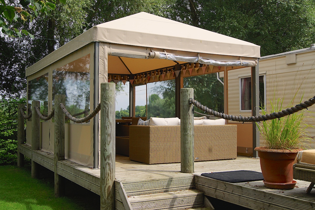 garden decking ideas a decking seating area under a gazebo CMXACXW