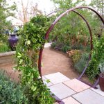 garden trellises above: the gracie modern arbor in aubergine. each sculpture is painted in ZPHOPJV