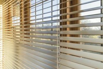 horizontal blinds gleaming horizontal wood blinds run across a bank of windows. WRFBRKE