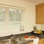 kitchen blinds faux wood venetian blinds in a kitchen KELCCXJ