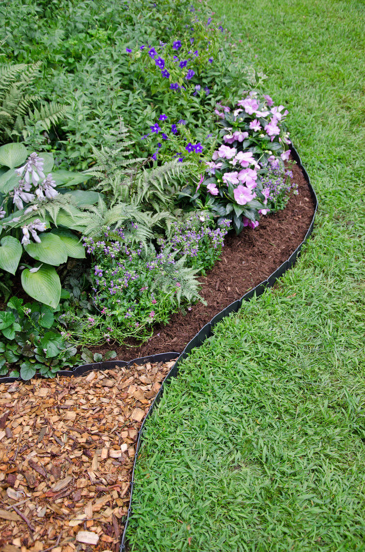 landscape edging ideas understated black plastic mulch edging IZWXNZJ