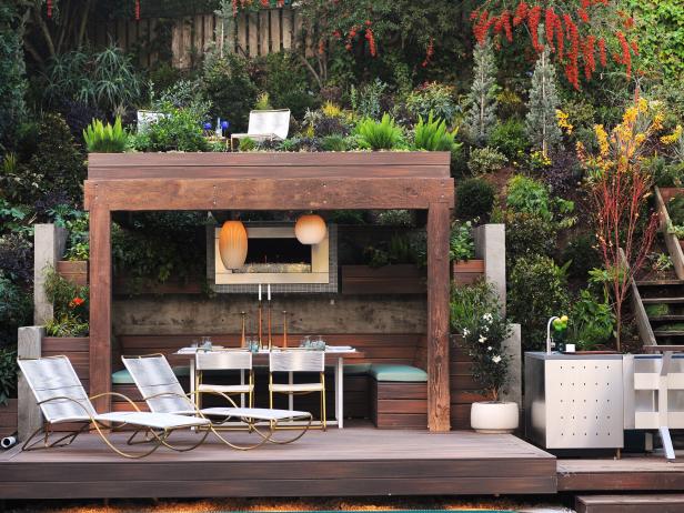 outdoor fireplace ideas small fireplace beneath pergola BYMCVTF