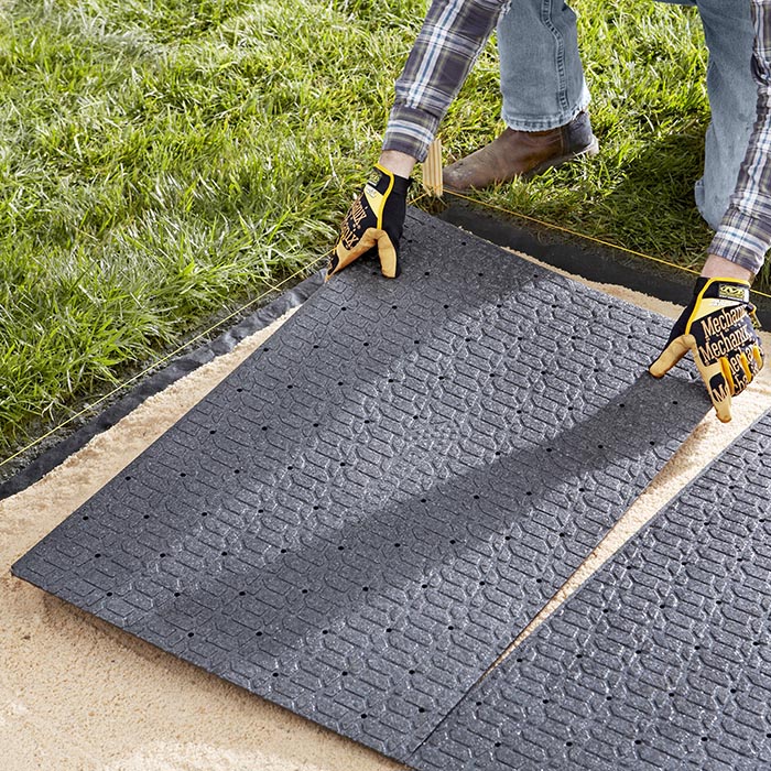 outdoor pavers installing paver panels for a patio made of paver blocks. MXZNCXK