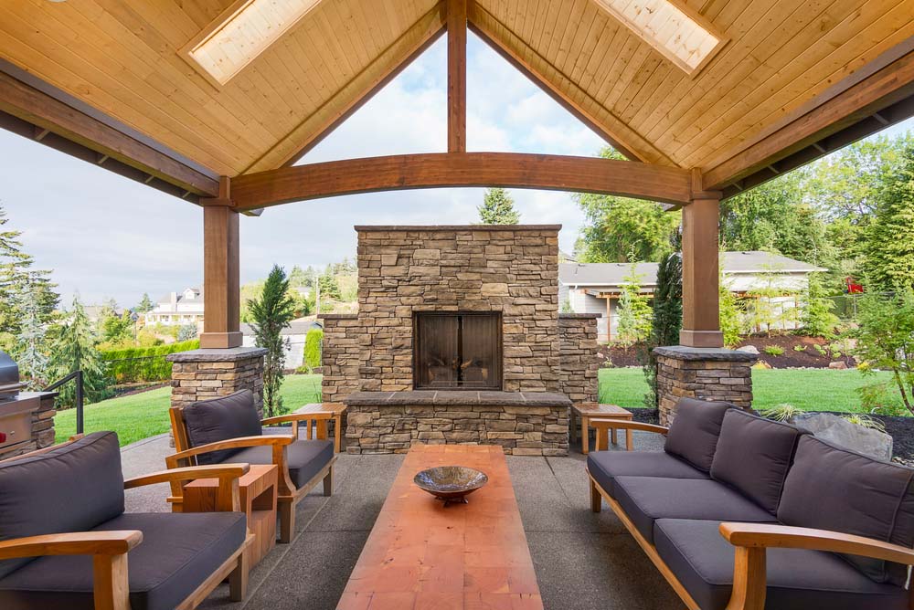 patio fireplace stone screened fireplace beneath arched wood patio XTJQNWU