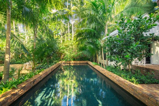 pool landscaping brick swimming pool and tropical plants JWFQLFV