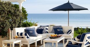 preppy navy and white patio furniture make for the perfect seaside setting. UNBYVPO