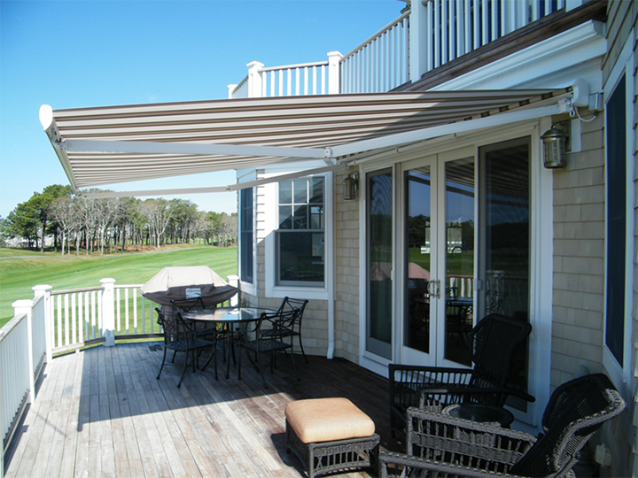 retractable awnings cream and brown striped awning extended over residential deck area JYSHBAR