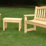 wood outdoor furniture cypress bench, chair, and table on lawn BFTHHOU