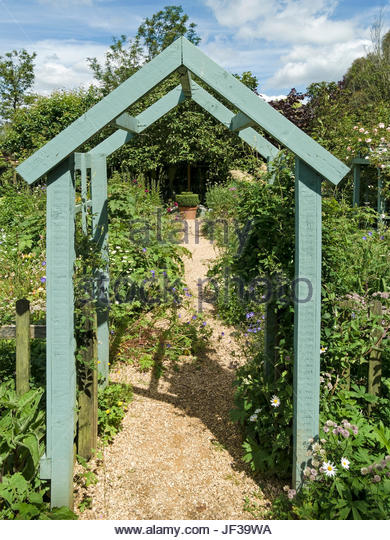 wooden garden arches green painted wooden arch arbour over garden path, barnsdale gardens,  oakham, AMKLXSX