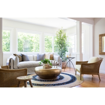 Using the round jute rug for  better looking living rooms