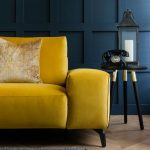 Luxury mustard yellow sofa perfect for dark moody living rooms