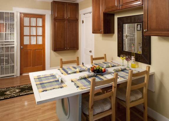 Foldable dining table attached to the wall