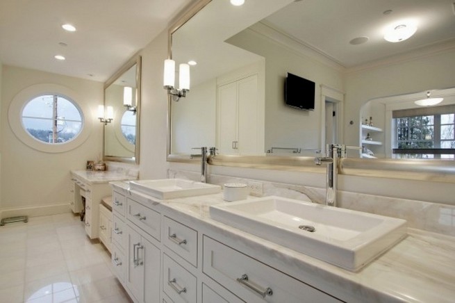 Framed mirrors above vanities