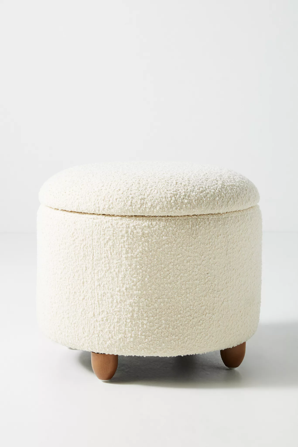 Round storage ottoman for room coziness