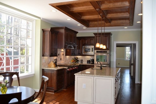 Cherry kitchen cabinets with white island