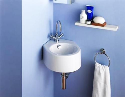 Space saving corner bathroom sink