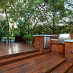 backyard decks a spacious deck features a barbecue area and a patio perfect for JSTLXGJ