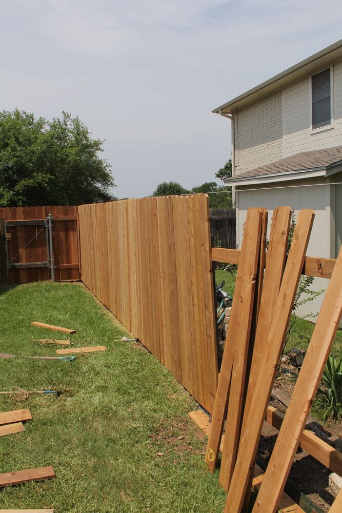 backyard fence ideas a very common example using standard cedar fence boards. by using these LSWFMEF