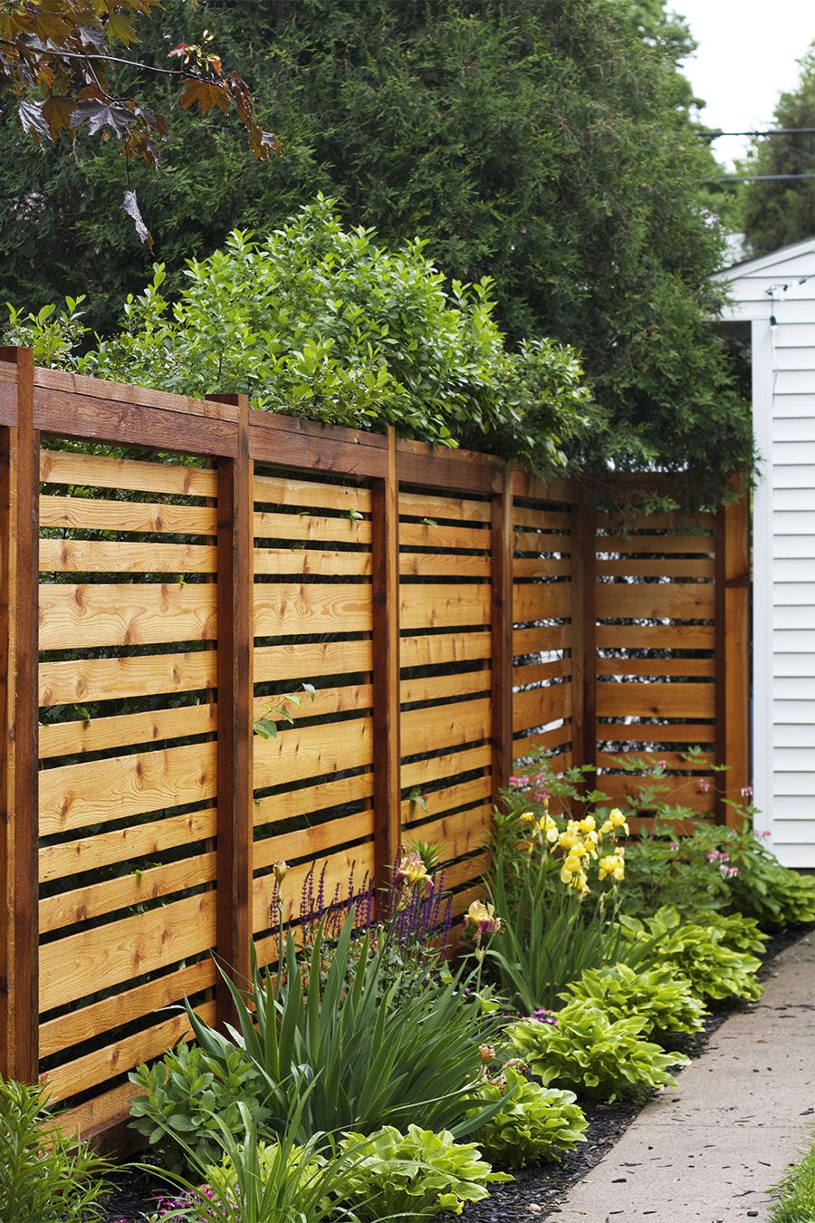 backyard fence ideas if we ever have to re-build our fence, this style is awesome. QCEKKRA