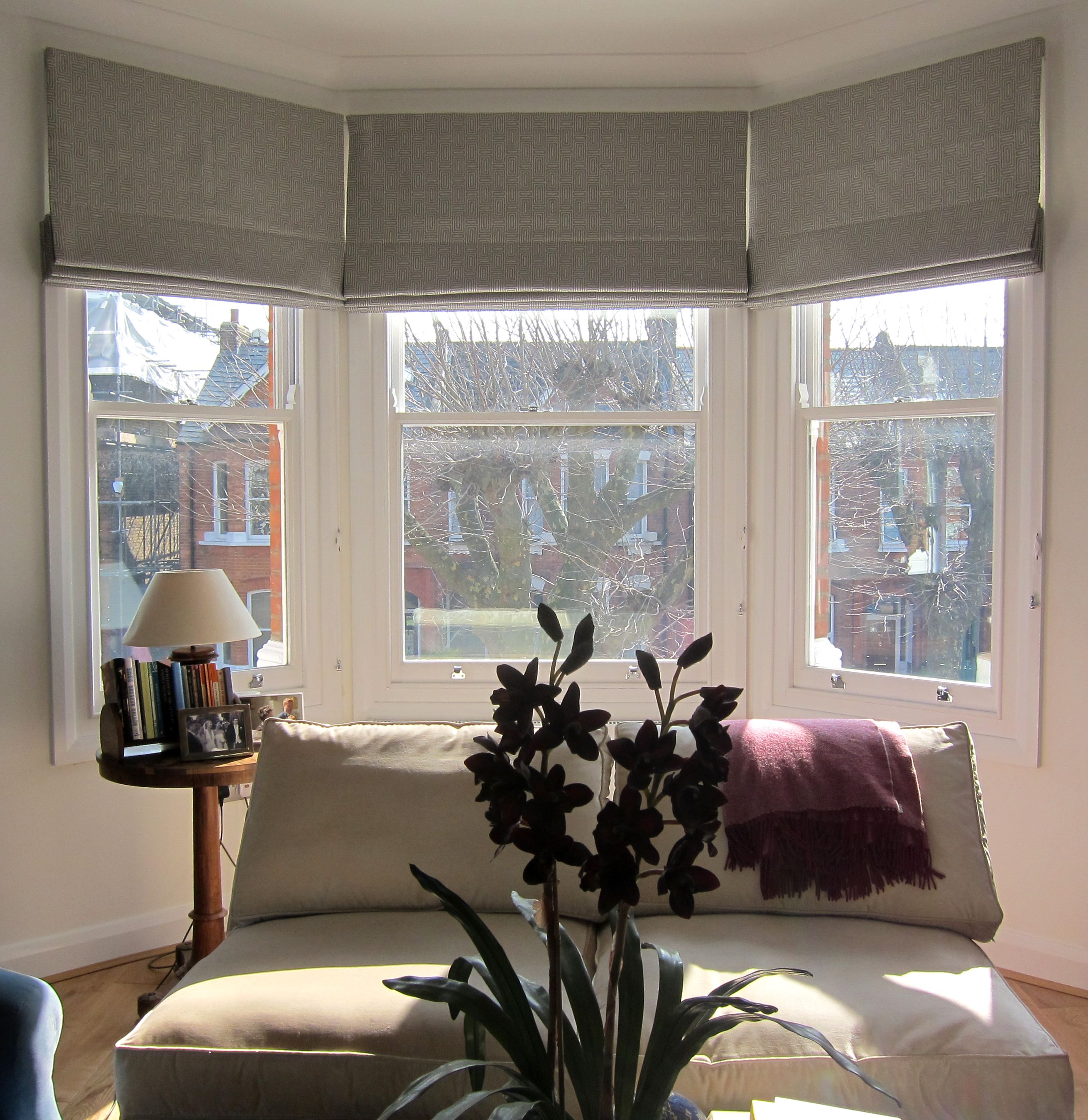 bay window blinds geometric patterned roman blinds in a bay window. could work in the KXQZZGS