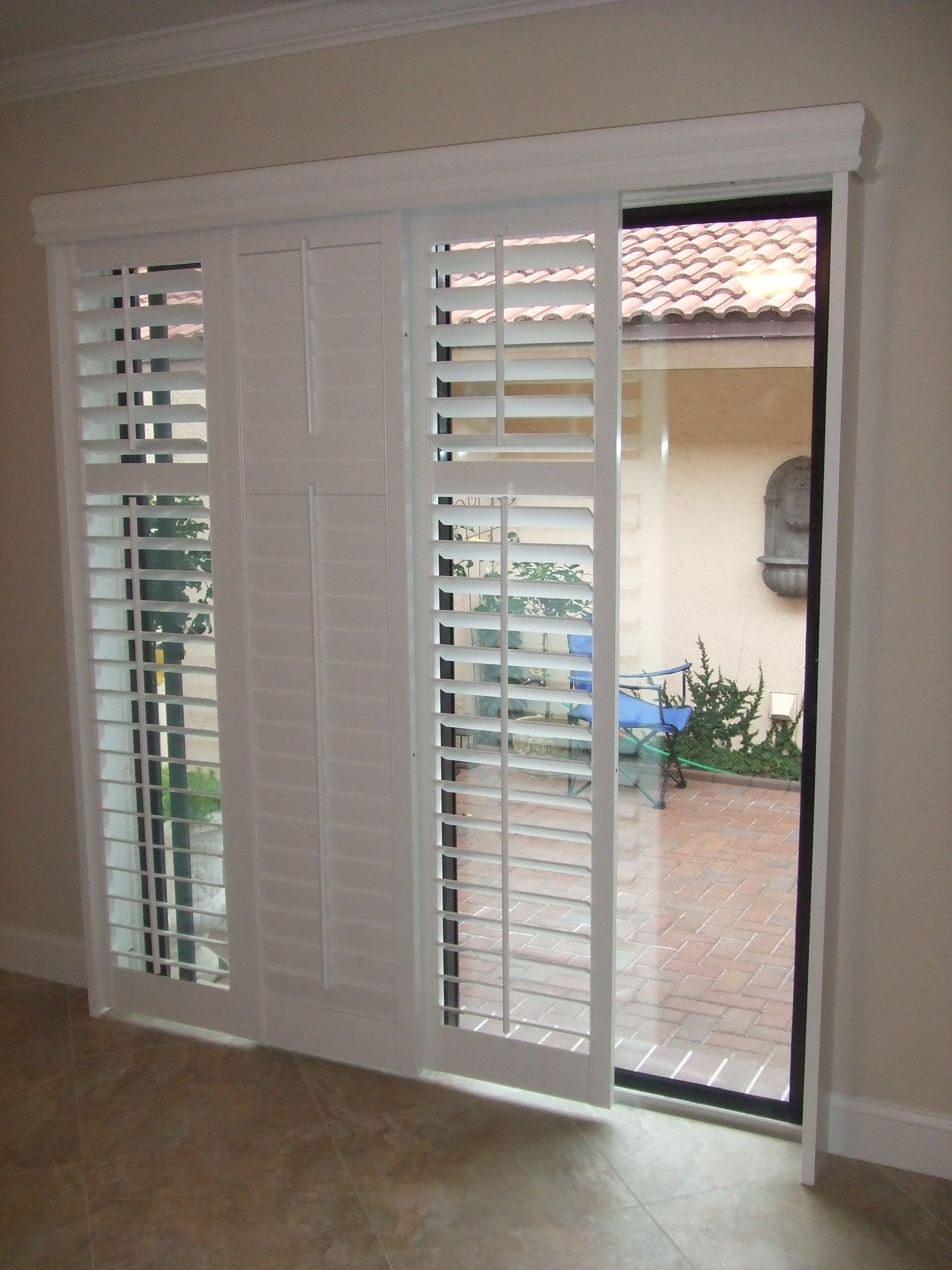 blinds for sliding doors modernize your sliding glass door with sliding plantation shutters LBVESXZ