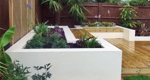 contemporary gardens contemporary deck garden with built-in seating and tropical planting ILAHDOV