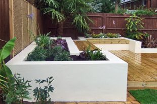 contemporary gardens contemporary deck garden with built-in seating and tropical planting ILAHDOV