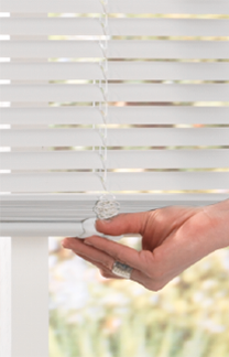 cordless blinds image showing a hand easily lifting/tilting a white cordless vinyl mini SUYMURW