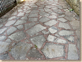 crazy paving poorly laid concrete flagstones. wide joints reveal too much mortar PKDRPOQ