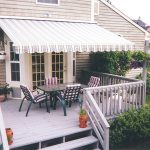 deck awnings striped awning over double doors with outdoor chairs and table on a GLIEFYJ