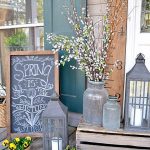 front porch decor lanterns, chalkboard, and antique glass porchscape POFXKKR