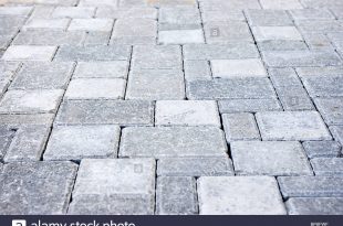 gray interlocking paving stone driveway from above - stock image ODUZJGM