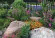 landscaping with rocks mix large rocks with flowers in beds. CLXRQCJ