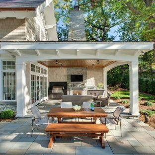 outdoor patio ideas inspiration for a timeless backyard stone patio remodel in minneapolis with PJXJWEO