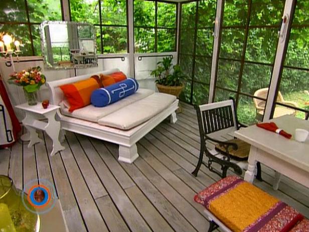outdoor room glass screened in porch with daybed and wood floors ZGWSCCX