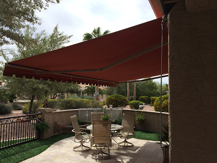 patio awnings red sunchoice awning over a medium size patio YVKBLPM